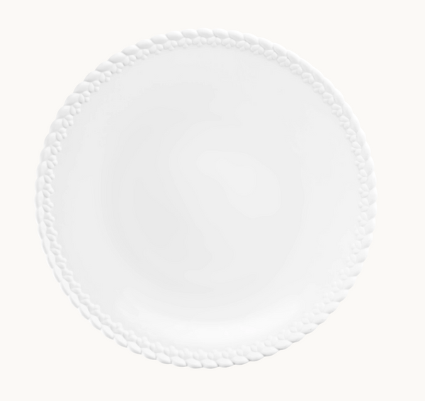 The Babylone Dinnerware by Christofle, a white porcelain plate featuring a braided edge design, is elegantly displayed from above on a white background.