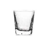 The Simon Pearce Woodbury DOF is a clear, empty Double Old-Fashioned tumbler with a subtly textured, wavy surface inspired by Georgian glassmaking, shown against a plain white background.