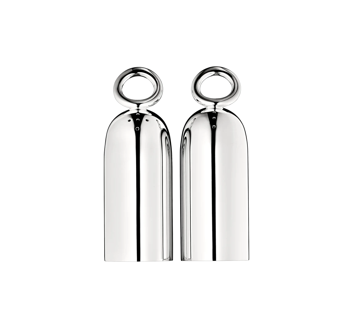 The Christofle Vertigo Salt and Pepper Shakers by Christofle feature rounded tops and circular handles, reflecting Andree Putman's elegant design as they sit side by side against a plain white background.