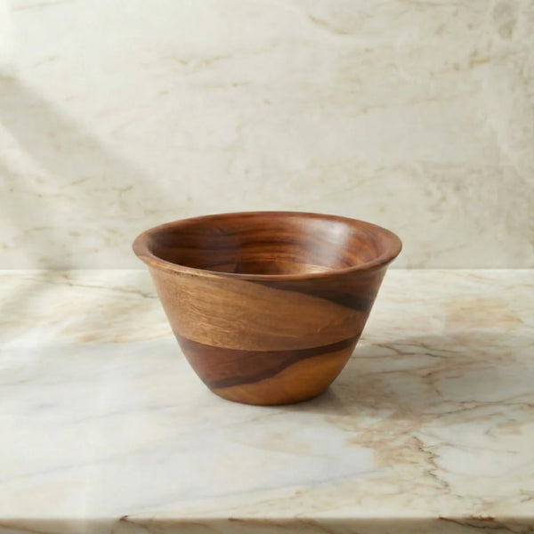 Wooden bowl on a marble surface