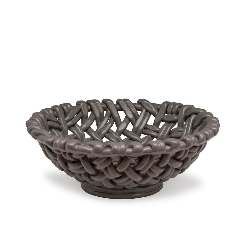 The Skyros Woven Basket - Round-15" is a dark gray, handwoven basket featuring thick interlaced strands and a matte finish, crafted by Portuguese artisans. Shown on a white background.