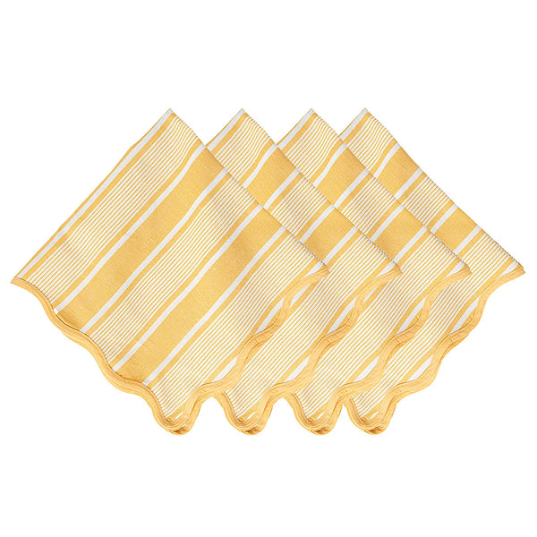 Four Cabana Stripe Napkins in the Sunshine colorway by Juliska are neatly arranged in a slightly overlapping fan pattern, with their wavy edges visible at the front of each napkin.