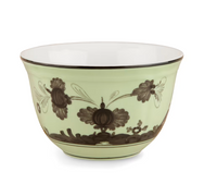 The Oriente Italiano Dinnerware Bario by Ginori 1735 is a porcelain bowl with a pale green exterior, intricate brown chinoiserie floral designs, and a white interior—an elegant showcase of Italian porcelain artistry.