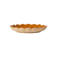 A shallow, scalloped-edge ceramic dish from the Marrakesh Dinnerware Yellow collection by Casafina/Costa Nova, crafted from eco-stoneware with a beige exterior and a glossy cumin yellow interior, displayed against a white background.