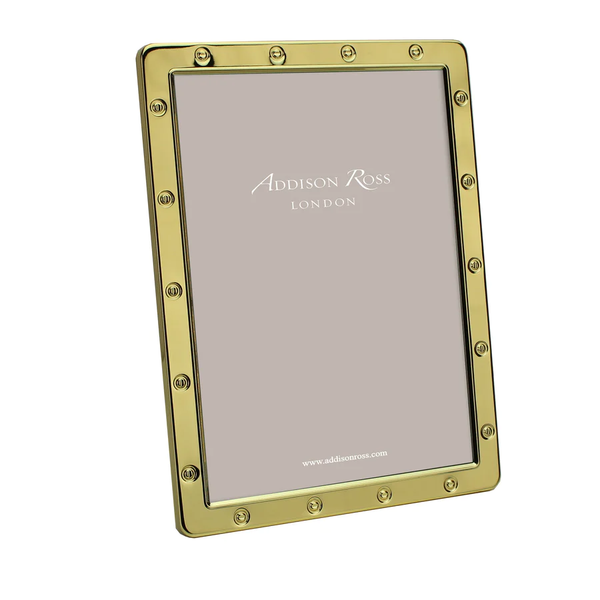 The Addison Ross Locket Frame Gold features raised stud details, stands upright with a blank insert, and is finished with dove grey velvet backing—an elegant frame presented in a gift box.