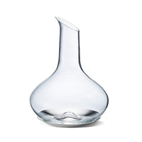 The Georg Jensen Sky Wine Decanter features clear glass with a wide, rounded base and a narrow, tilted spout, perfect for aerating fine wines and displayed on a white background.