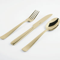 The Sambonet Flat PVD Flatware 5 Piece Setting in Champagne is shown with the fork, knife, and spoon arranged side by side on a white background.