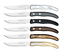 The Claude Dozorme Berlingot Steak Knives Grey & Brown Set of 6 features stainless steel serrated blades and handles in silver, black, dark brown, light brown, pearl brown, and pearl white. Made in France.