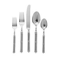 A Ricci Castello Flatware Silver 5-Piece Setting in 18/10 stainless steel—salad fork, dinner fork, knife, soup spoon, and teaspoon—features decorative handles and is arranged on a white background.