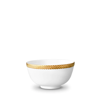 The L'Objet Corde Dinnerware Gold is a white porcelain bowl with a simple round shape, accented by a hand-painted gold rope pattern around the rim for modern elegance in any dining setting.