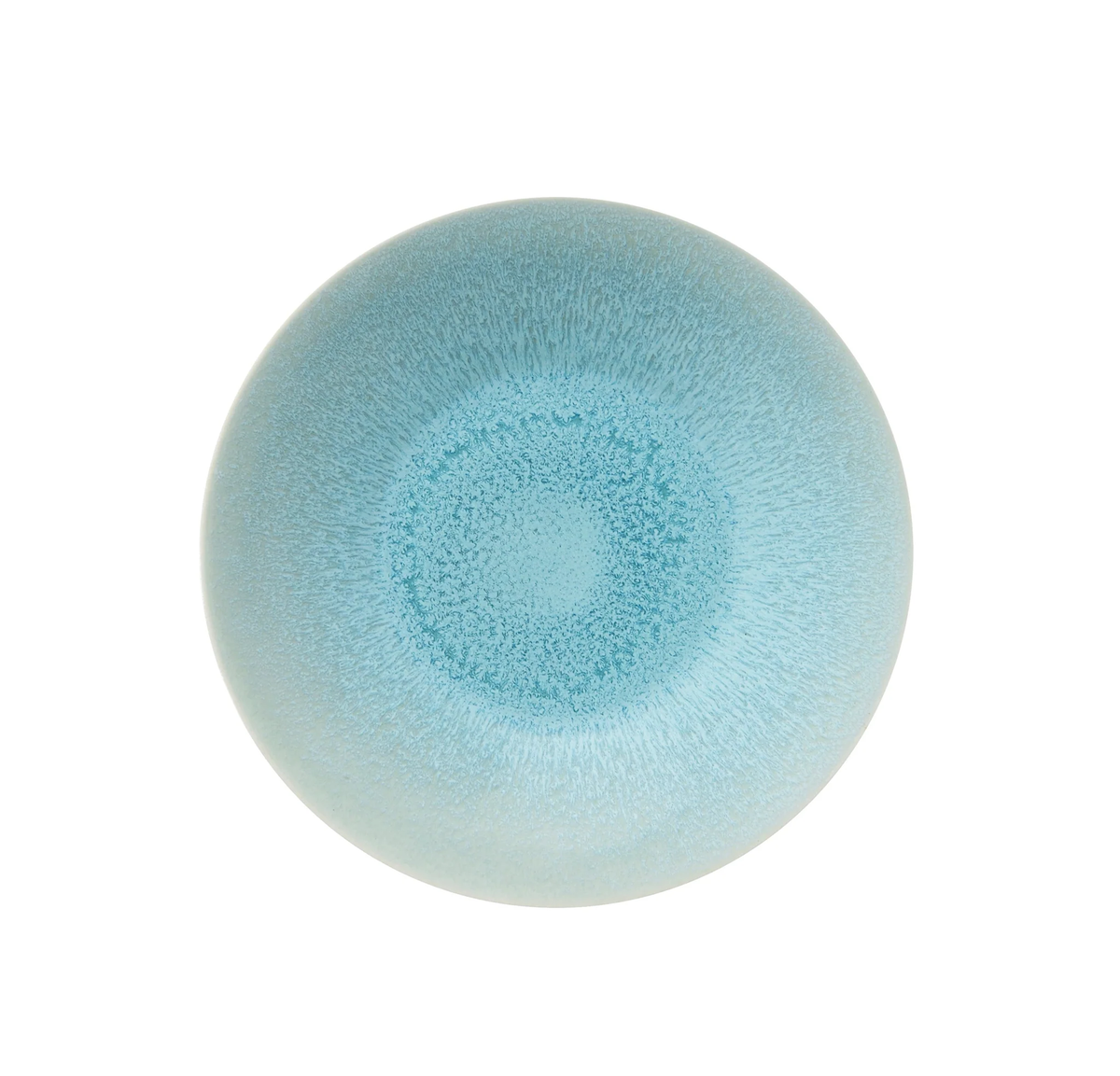 The Vuelta Atoll ceramic bowl by Jars - Rosenthal showcases a smooth blue gradient deepening at the center, a slightly speckled surface, and a glossy finish—combining modern dinnerware elegance with microwave safety.