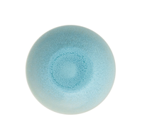 The Vuelta Atoll ceramic bowl by Jars - Rosenthal showcases a smooth blue gradient deepening at the center, a slightly speckled surface, and a glossy finish—combining modern dinnerware elegance with microwave safety.