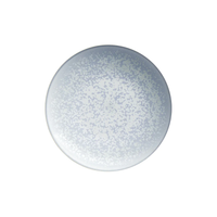 The Song Ocean Dinnerware round ceramic plate by Jaune De Chrome features a light blue and white speckled pattern, inspired by French dinnerware, shown from above on a white background.