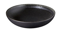 The Tourron Dinnerware Celeste by Jars - Rosenthal is a round, shallow stoneware plate with black glaze, a textured surface, and a slightly raised rim, shown on a white background.