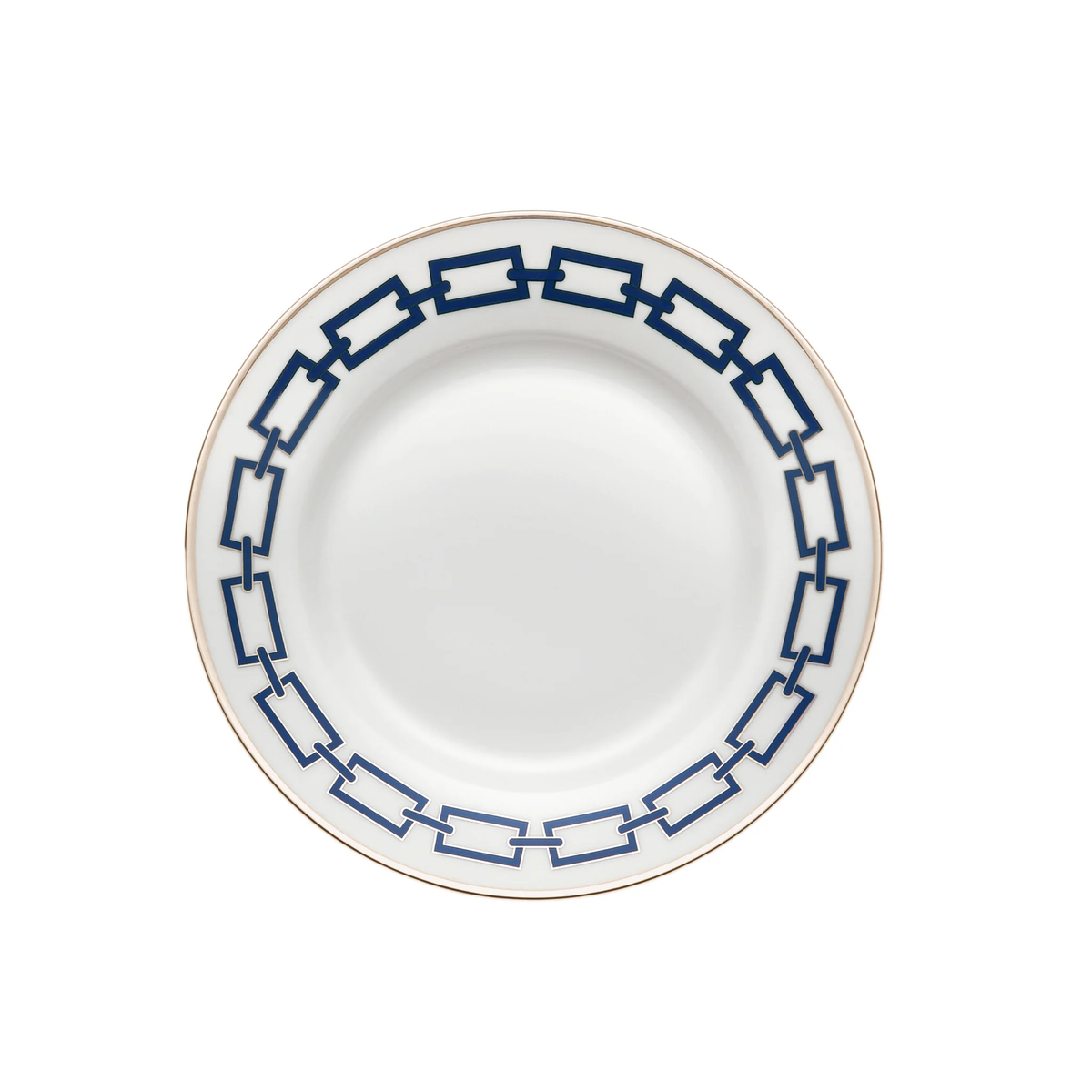 The Catene Zaffiro Dinnerware by Ginori 1735 features a white ceramic plate with a gold rim and bold navy blue chain-link pattern around the edge, inspired by designer porcelain. The center remains plain for an elegant look.