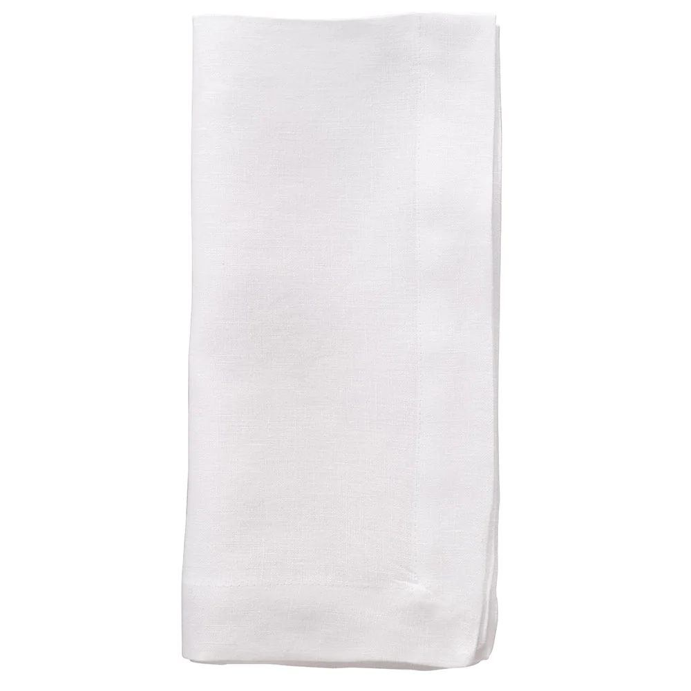 A neatly folded Riviera Napkin from Bodrum, part of a set of 4 plain white soft linen napkins, displayed against a white background.