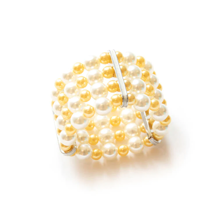 The Pearl Cuff Napkin Ring Gold Set of 4 by Von Gern Home features alternating white and gold pearl beads with three parallel silver bars, perfect for elegant table settings. Displayed on a white background.