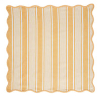 A square fabric napkin from Juliska’s Cabana Stripe Napkin Set of 4 - Sunshine, featuring yellow and white vertical stripes of varying widths and wavy, scalloped edges. The napkin is displayed flat on a white background.