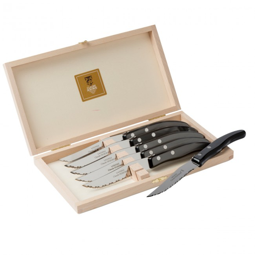 A wooden box holds the Claude Dozorme Berlingot Steak Knives Grey Set of 6—French-made, each with a grey handle, one knife displayed separately, and a gold label inside the lid.