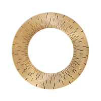 A gold-colored, circular mirror with a textured, sunburst-like frame inspired by the artistry of Haviland's Infini Prestige Gold Dinnerware. Radiating lines—some broken or shorter—add visual interest reminiscent of fine Limoges porcelain.
