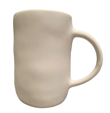 The Urban Dinnerware Matte White mug by Alex Marshall Studios features a plain, unglazed ceramic finish with a rounded, slightly uneven shape and large curved handle, evoking handmade stoneware. Shown against a white background.
