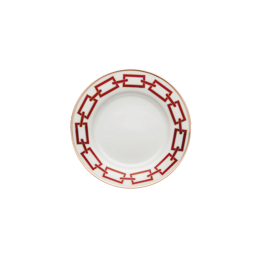 The Catene Scarlatto Dinnerware by Ginori 1735 is a white ceramic plate featuring a bold red Gio Ponti-inspired geometric chain pattern around the rim and a thin gold border, shown against a white background.
