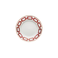 The Catene Scarlatto Dinnerware by Ginori 1735 is a white ceramic plate featuring a bold red Gio Ponti-inspired geometric chain pattern around the rim and a thin gold border, shown against a white background.