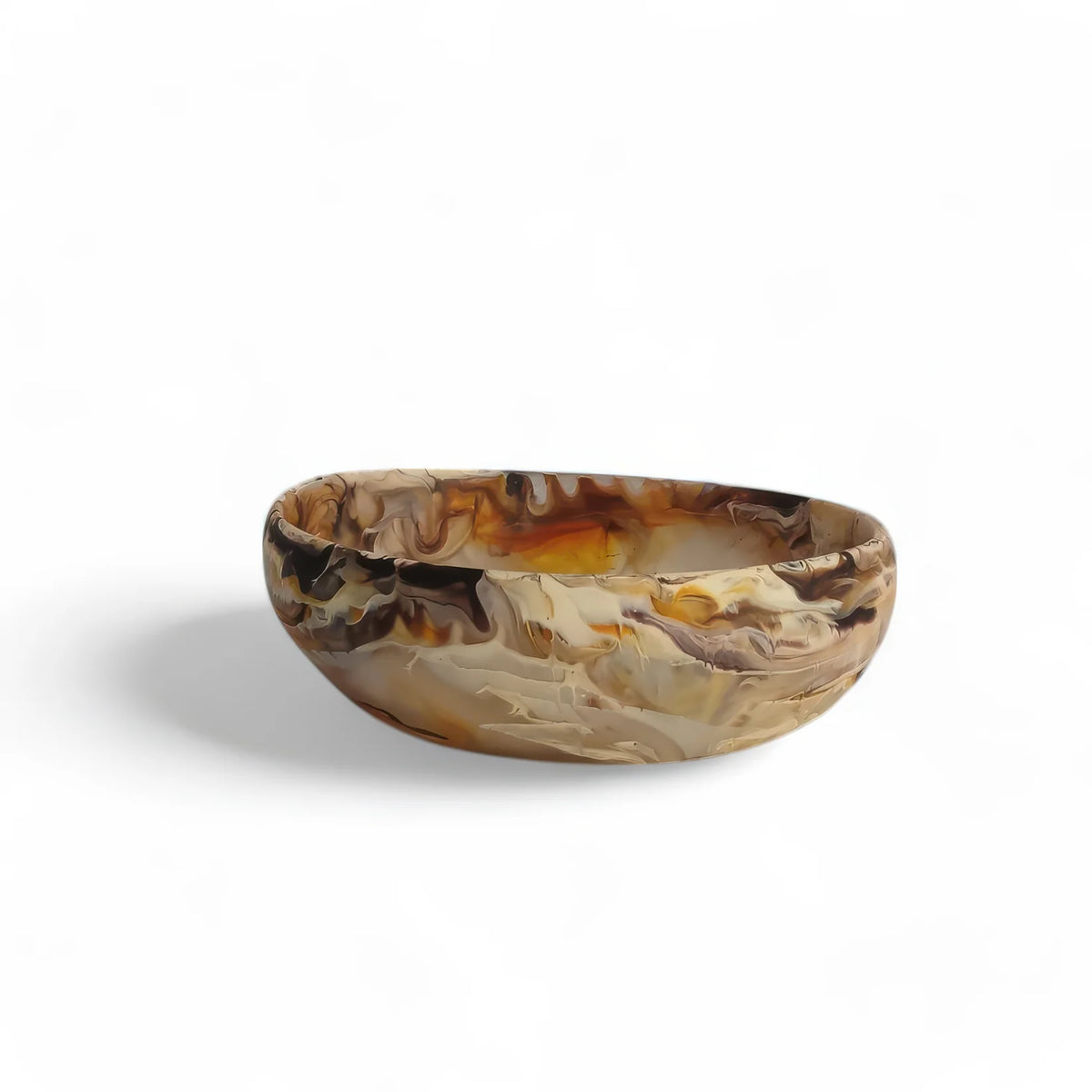 The Nashi Home Arila Small Bowl - Mocha showcases a marbled mocha pattern in brown, beige, and tan shades, evoking gentle ocean waves against a crisp white background.