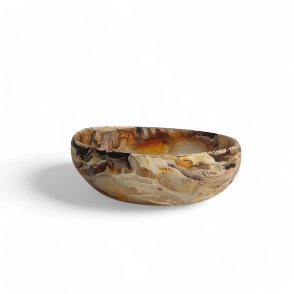 The Nashi Home Arila Small Bowl - Mocha showcases a marbled mocha pattern in brown, beige, and tan shades, evoking gentle ocean waves against a crisp white background.