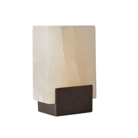 The Arteriors Tolliver Bookends Set of 2 features striking design, perfect for pairing with a modern table lamp with a rectangular frosted white shade and dark base, elegantly displayed against a plain white background.