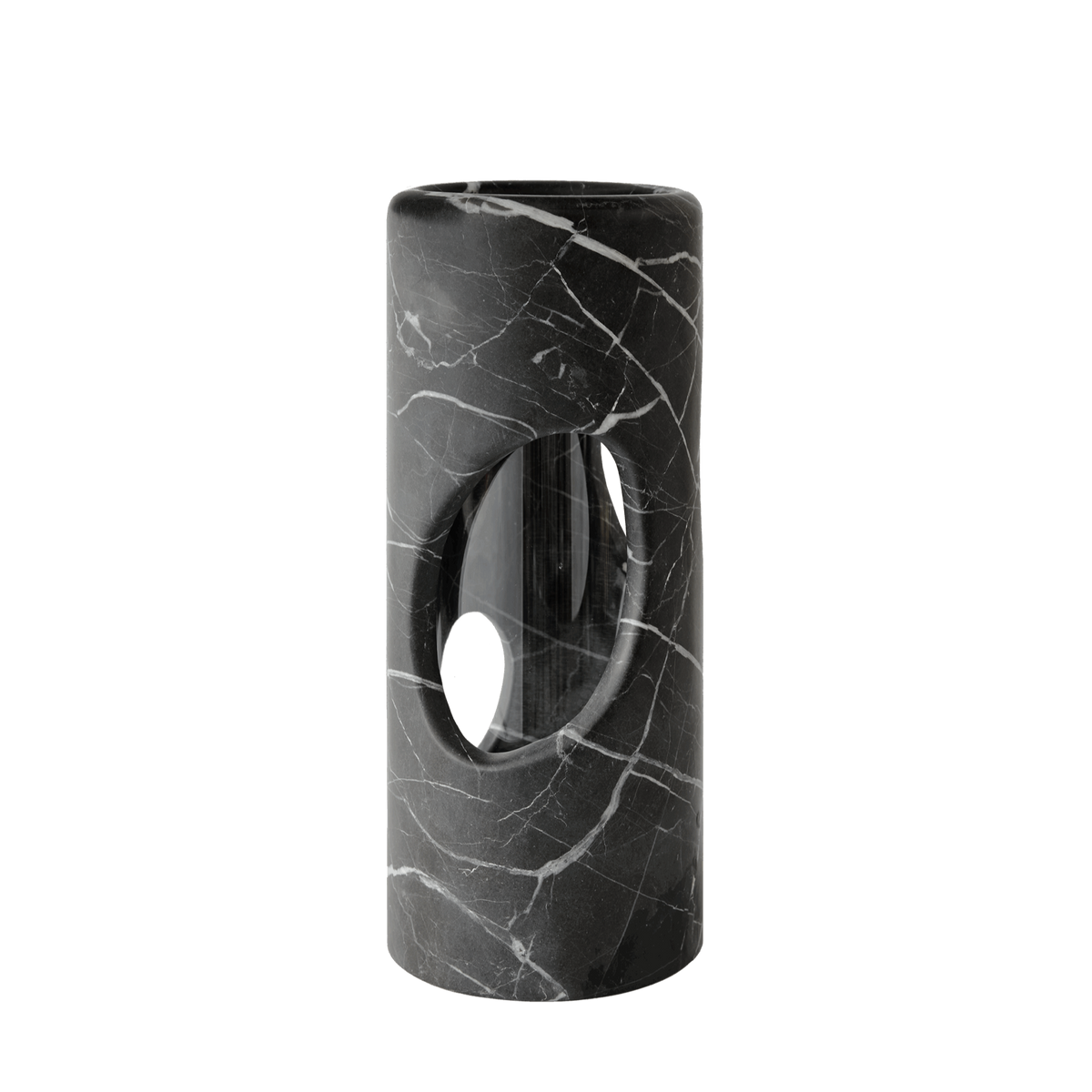 The modern cylindrical black marble side table with white veining and an oval cutout pairs elegantly with the Pietra Marble Vase by Greg Natale, creating a chic minimalist display against a plain white background.