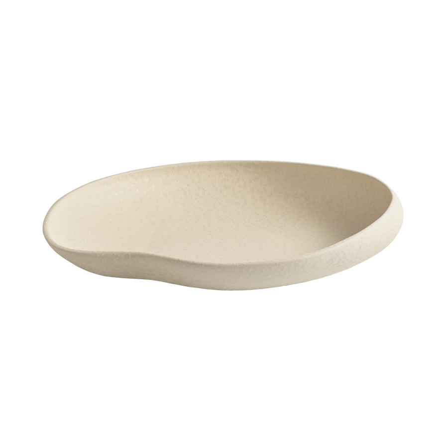 The Tefra Bowl by Greg Natale is a shallow, cream-toned ceramic plate with an organic, irregular shape and matte finish—ideal for chic interior styling or pairing with sculptural serveware—shown on a plain white background.