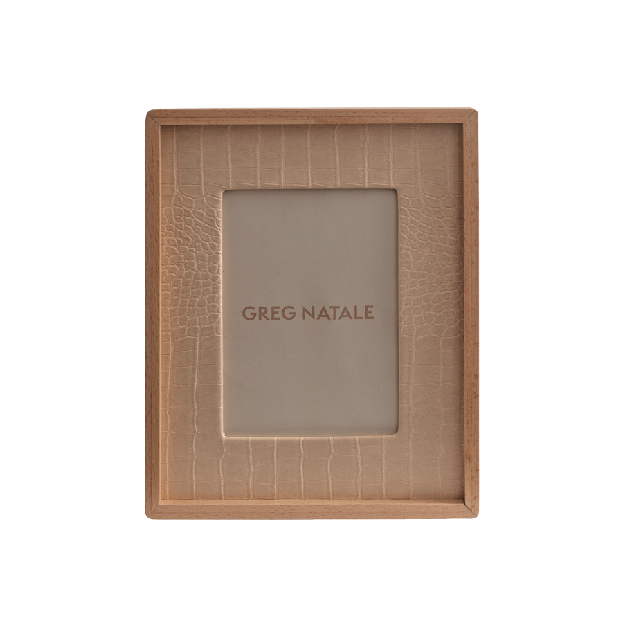 The Terreno Leather & Walnut Frame by Greg Natale features a rectangular design with a textured beige inner border, ideal for modern interiors, and displays the Greg Natale name at the center on a plain background.