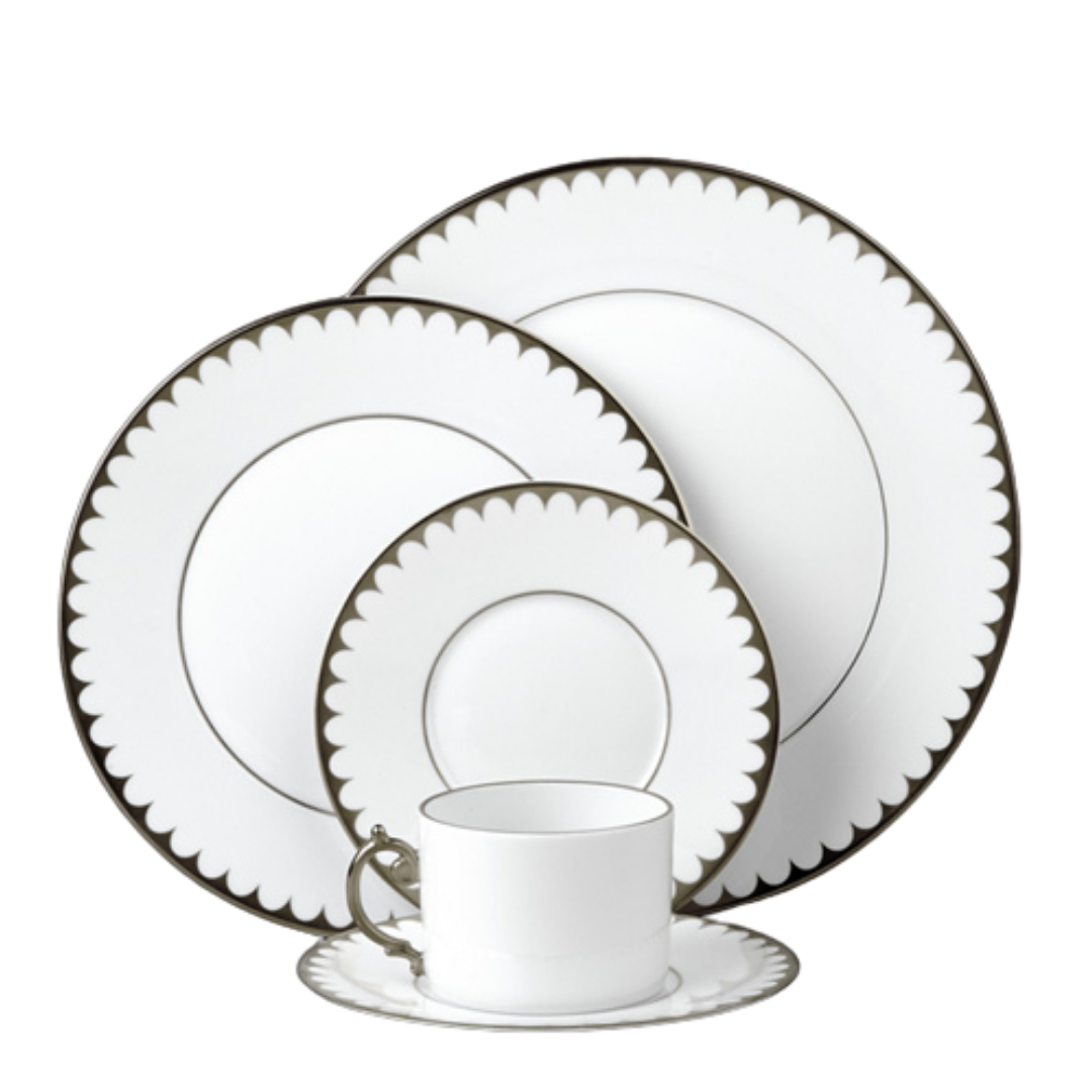 L'Objet's Aegean Filet Platinum Dinnerware set features white porcelain with scalloped dark borders and includes a dinner plate, salad plate, bread plate, teacup, and saucer—all in a matching, refined design.