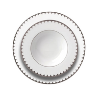 A set of three L'Objet Aegean Filet Platinum Dinnerware plates, stacked from largest to smallest on a white background, highlights the refined scalloped edges and platinum accents of this elegant porcelain collection.