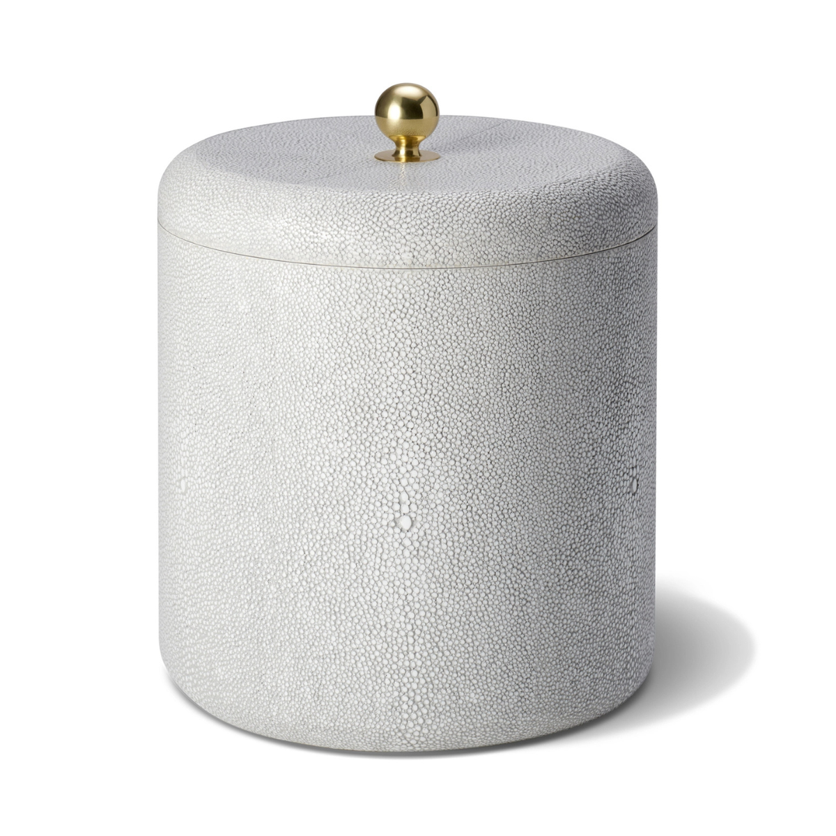 The Aerin Shagreen Ice Bucket features a cylindrical, white textured design with a matching lid and gold knob, bringing elegant luxury to any home bar.
