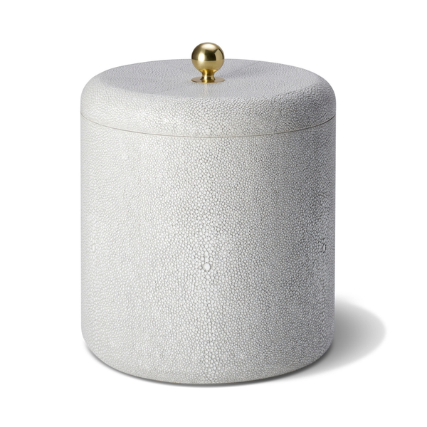 The Aerin Shagreen Ice Bucket features a cylindrical, white textured design with a matching lid and gold knob, bringing elegant luxury to any home bar.
