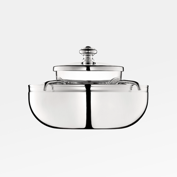 The Christofle Albi Silver Plated Caviar Set features a rounded, symmetrical design with a matching lid and the elegant Albi pattern, photographed on a plain white background for a modern touch.