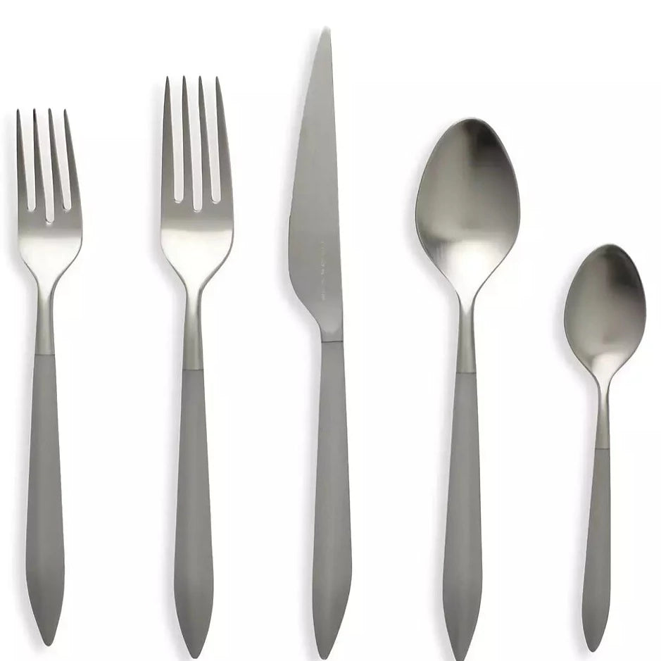 The Vietri Ares Oro Flatware 5 Piece Setting - Grey includes two forks, a knife, a tablespoon, and a teaspoon with sleek gray handles and polished 18/10 stainless steel heads, arranged side by side on a white background.
