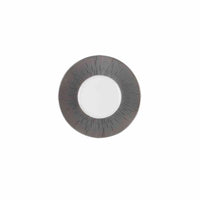 A single gray contact lens with a clear center and a patterned, radial design of thin black lines on white, inspired by the Haviland Anthracite Infini Dinnerware Grey.