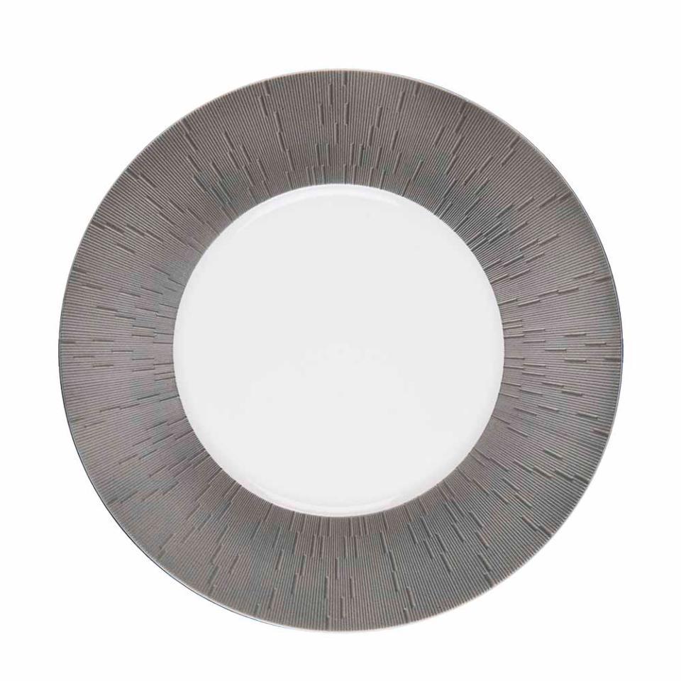 The Haviland Anthracite Infini Dinnerware Grey plate features a concentric radiating pattern of dark gray lines on the rim and is crafted from fine Limoges porcelain.