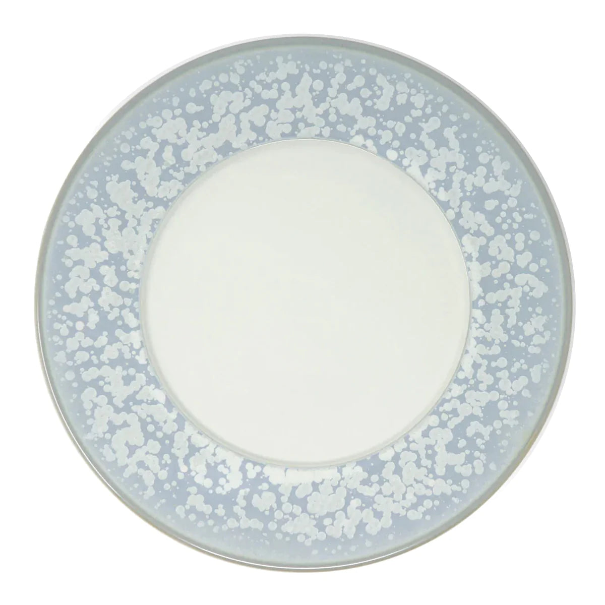 The Song Ocean Dinnerware by Jaune De Chrome is a round ceramic plate with a wide light blue border featuring a white speckled pattern and a solid white center.