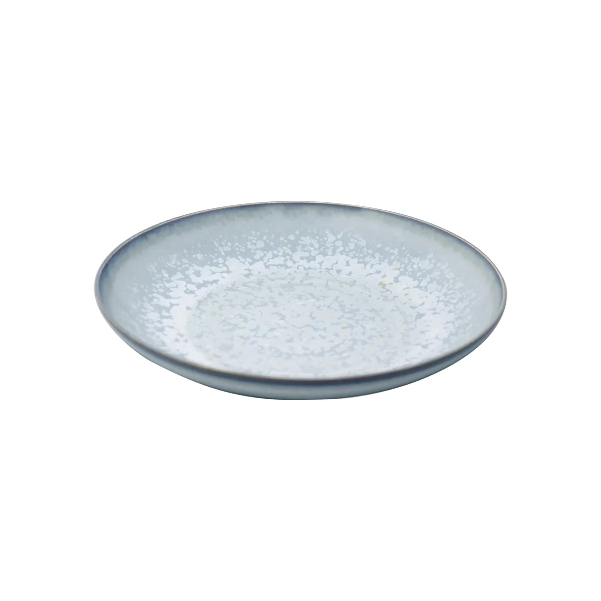 The Song Ocean Dinnerware by Jaune De Chrome is a round, shallow ceramic plate featuring a light blue and white speckled pattern reminiscent of classic French dinnerware, displayed on a plain white background.