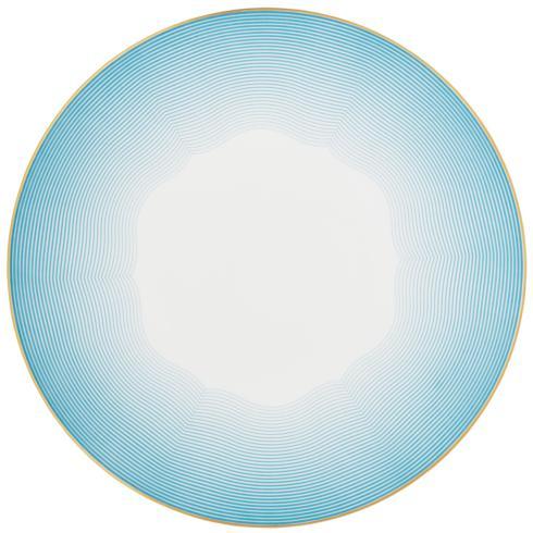 The Aura Dinnerware by Raynaud features a round plate with a white center, blue gradient concentric lines, and a gold-rimmed scalloped edge. Its contemporary French design combines elegance with modern style.