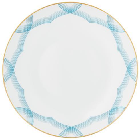 The Aura Dinnerware by Raynaud features a white plate with a thin gold rim and a repeating light blue curved line pattern along the edge, while its plain center highlights a contemporary design.
