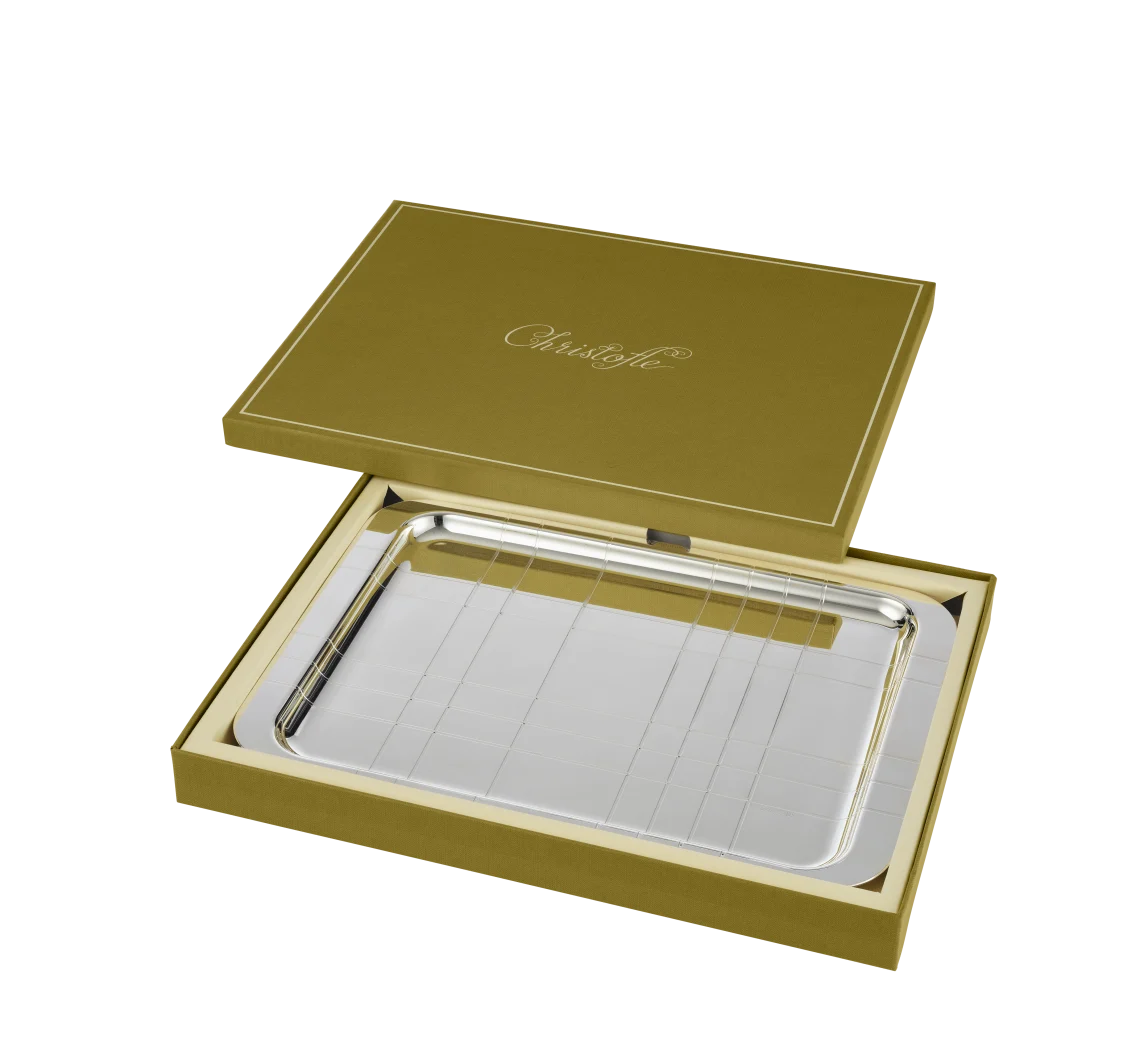 The Christofle Graphik Silver Plated Rectangular Tray, featuring a modern elegant design, is presented in an open olive green gift box with the Christofle logo embossed on the lid.