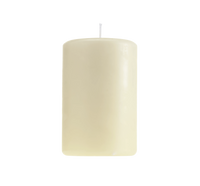 A tall, ivory pillar candle with a white wick stands on a white background, ideal for pairing with Christofle’s Babylone Silver Plated Candle Holder to enhance your luxury home decor.