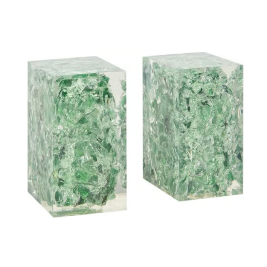 The Jessie Bookends Set by Made Goods features two clear rectangular resin bookends filled with irregular green glass-like fragments—ideal decorative shelf accessories.