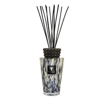 The Baobab Totem Pearls Black Diffuser features a black and white spotted glass design, black pearl finish, glazed ceramic cap, fragrance oil with black reeds, and is labeled with the Baobab Collection logo.