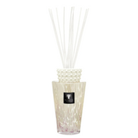 The Totem Pearls White Diffuser by Baobab features a decorative glass design with a textured white collar, filled with liquid and white reeds—an elegant touch to enhance your home fragrance experience.